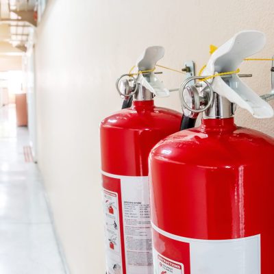 Fire extinguisher system on the wall background, powerful emergency equipment for industrial