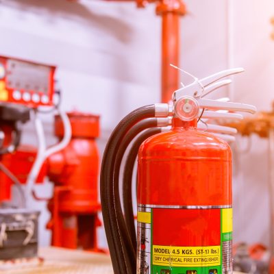 Red tank of fire extinguisher Overview of a powerful industrial fire extinguishing system.